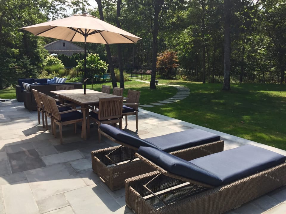 Back patio with chaise lounges