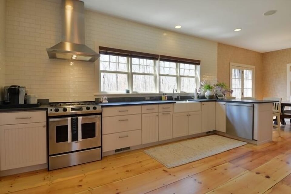 Chef's kitchen stocked with all necessities, perfect for entertaining