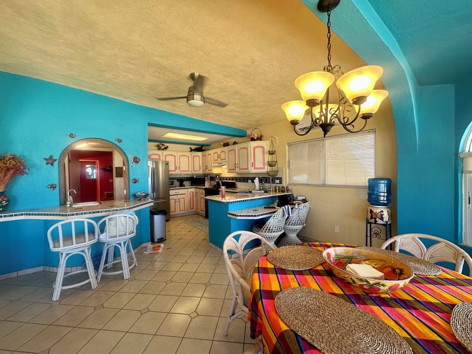 Kitchen - dining - bar seating area 