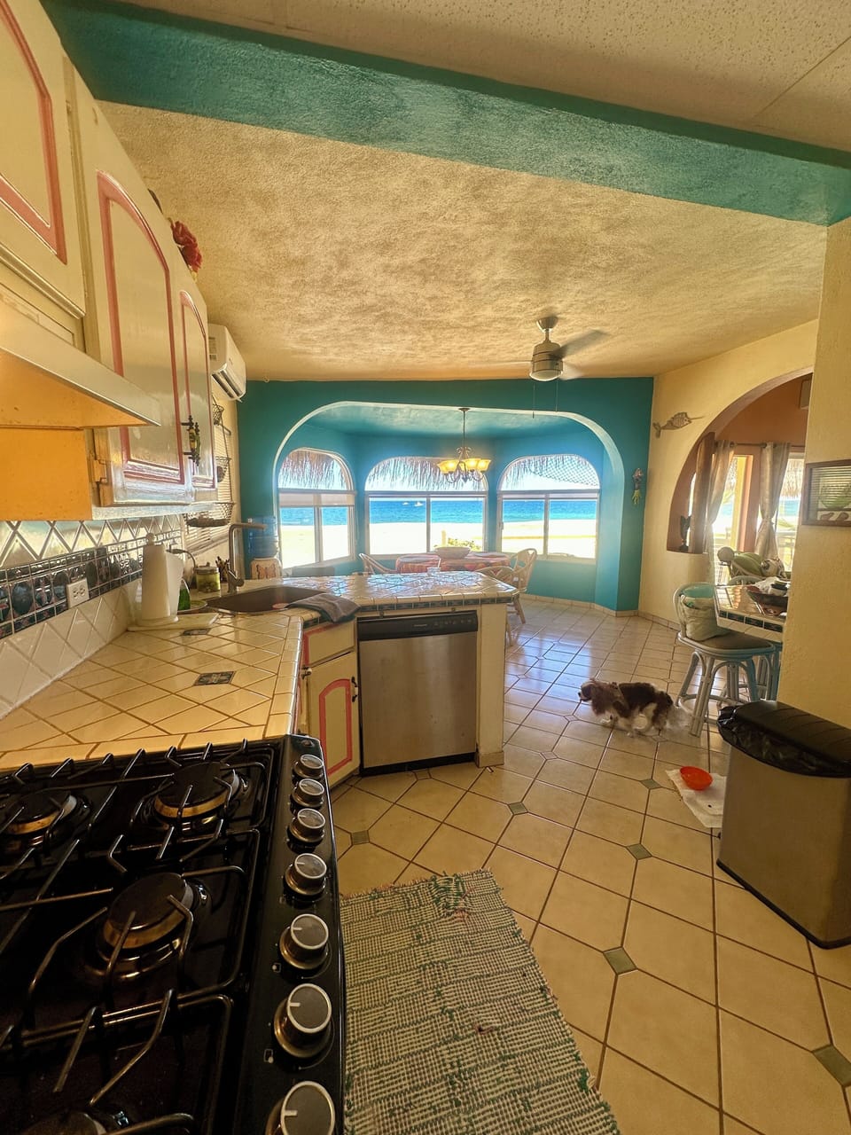 Kitchen view to dining overlooking water 