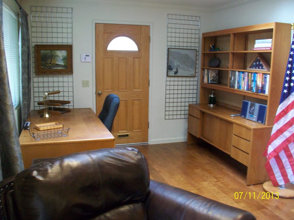 Work area with desk and shelves.