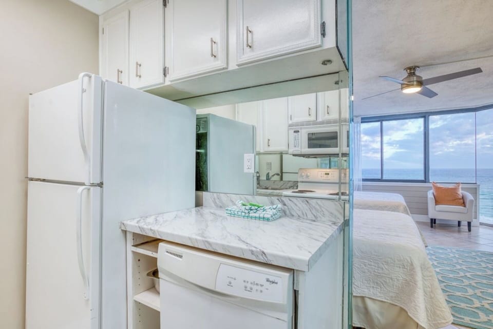 Full Kitchen with oven, stove, microwave, ice maker, and dishwasher