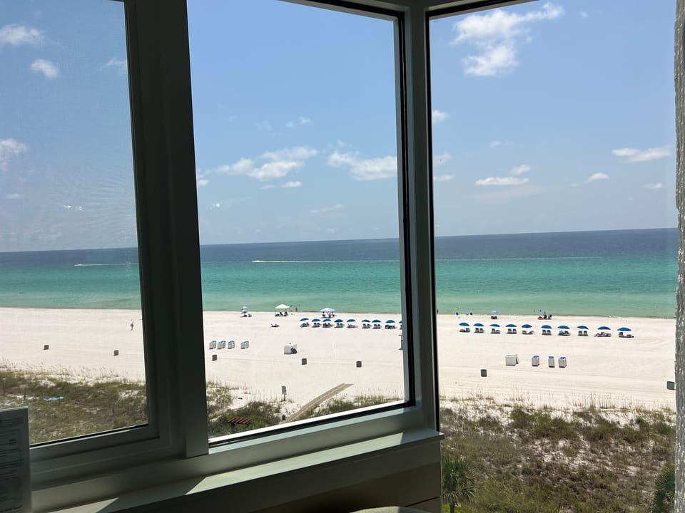 Your view—emerald water and white sand right outside