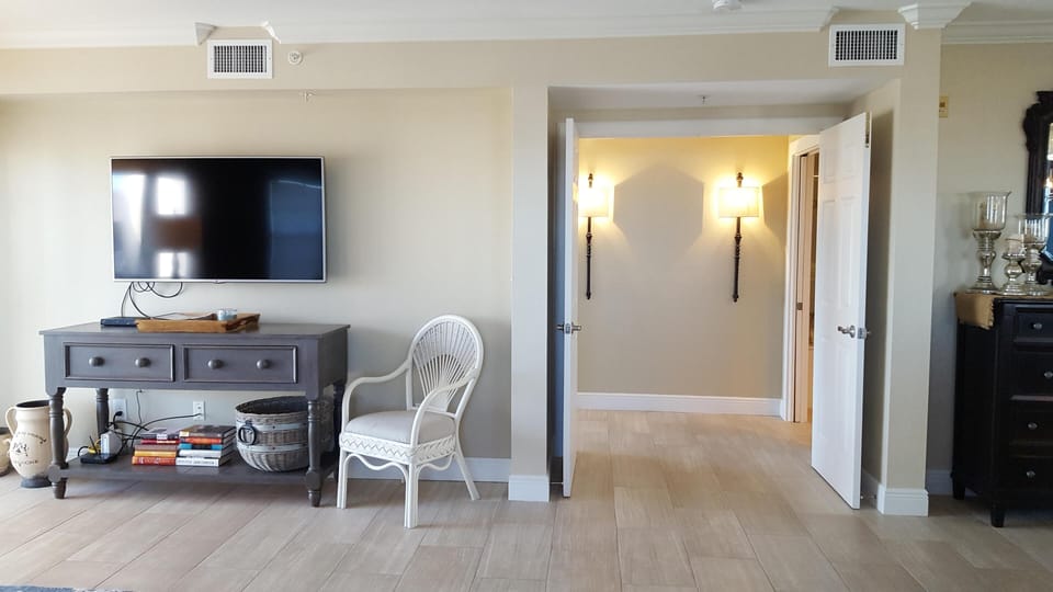 Living Room with large flat screen TV and Lanai Access