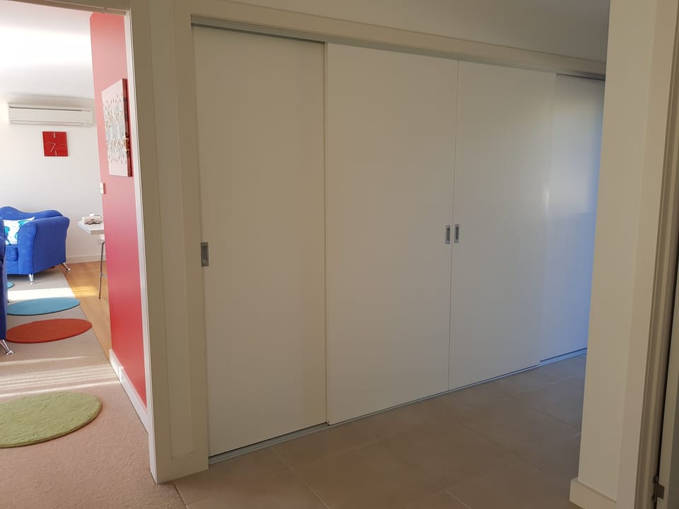 Laundry area with sliding doors