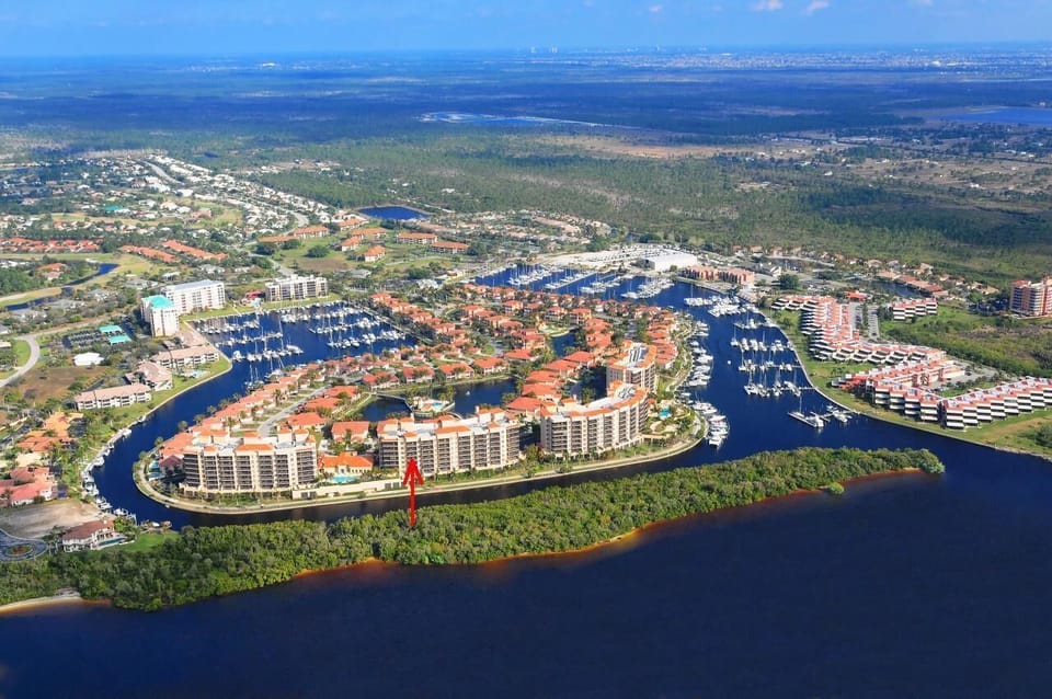 Burnt Store Marina & Country Club view to east - arrow indicates condo location