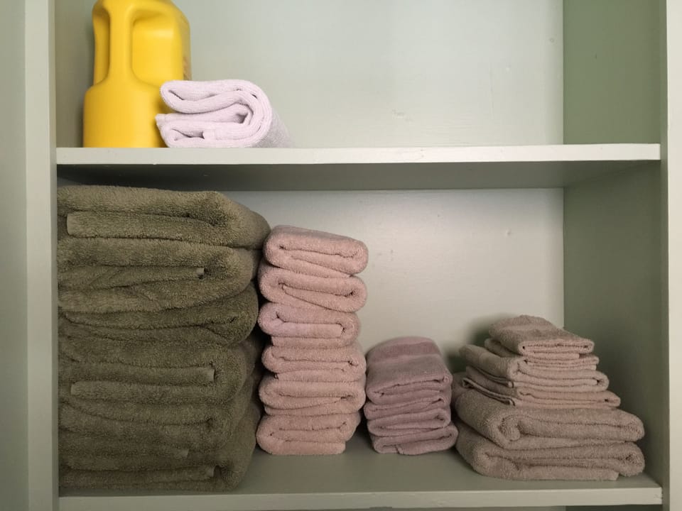 Towels and linens are provided.