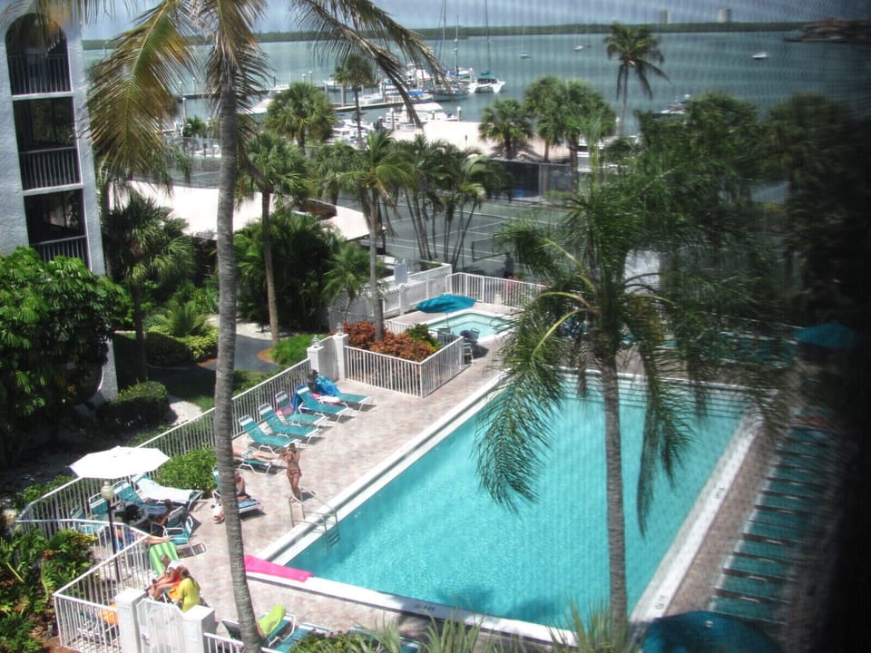 POOL VIEW FROM LANAI - TOP FLOOR CORNER CONDO