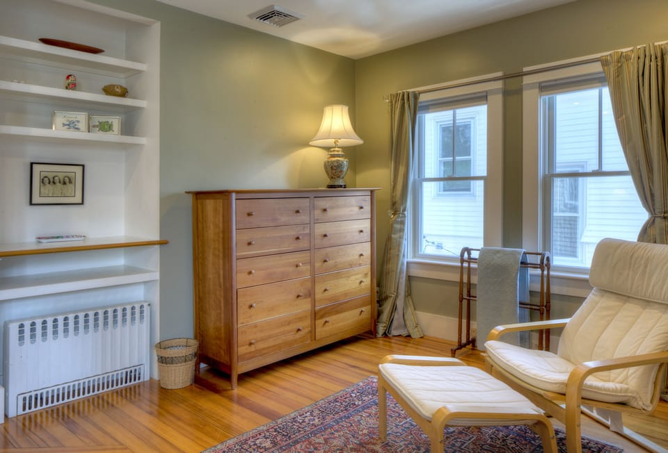 The master bedroom has plenty of light and storage space.