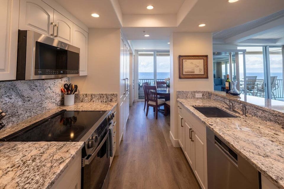 The sleek, galley-style kitchen is well organized and well equipped, with plenty of workspace.