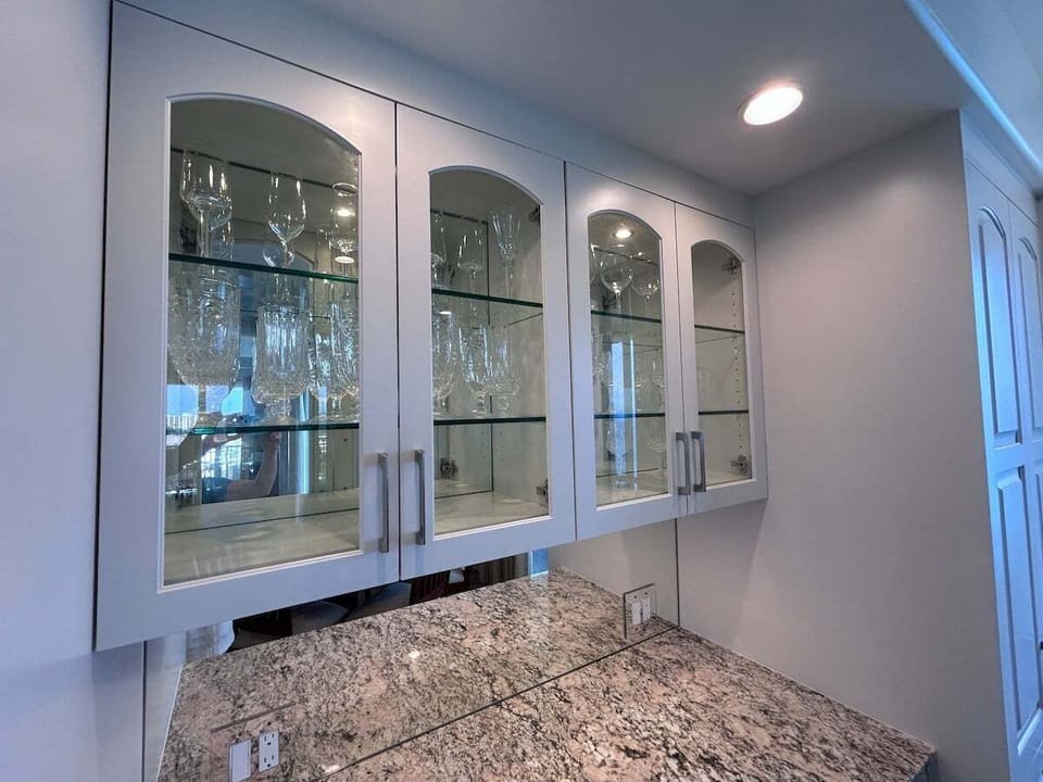 Built-in cabinetry showcases the beautiful crystal stemware, perfect for celebrating special occasions or unwinding in luxury after a day in paradise.