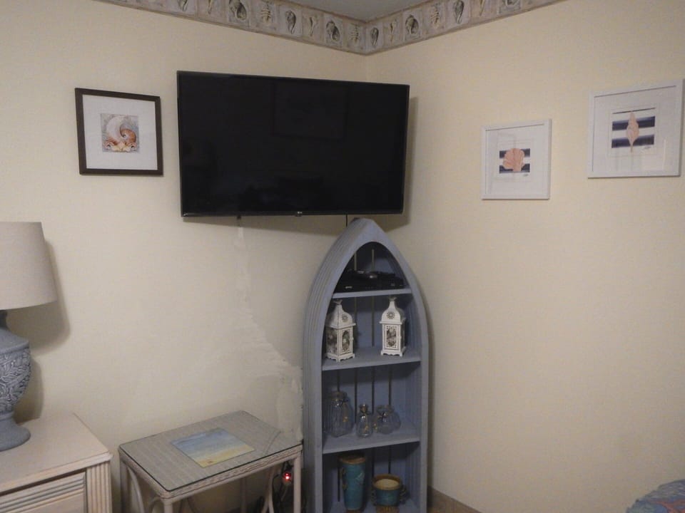 New wall mounted 43" TV in bedroom and new decor