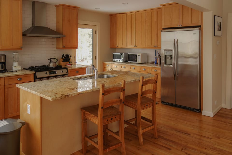 Marble counter tops through kitchen with incredible tasting well water resource.