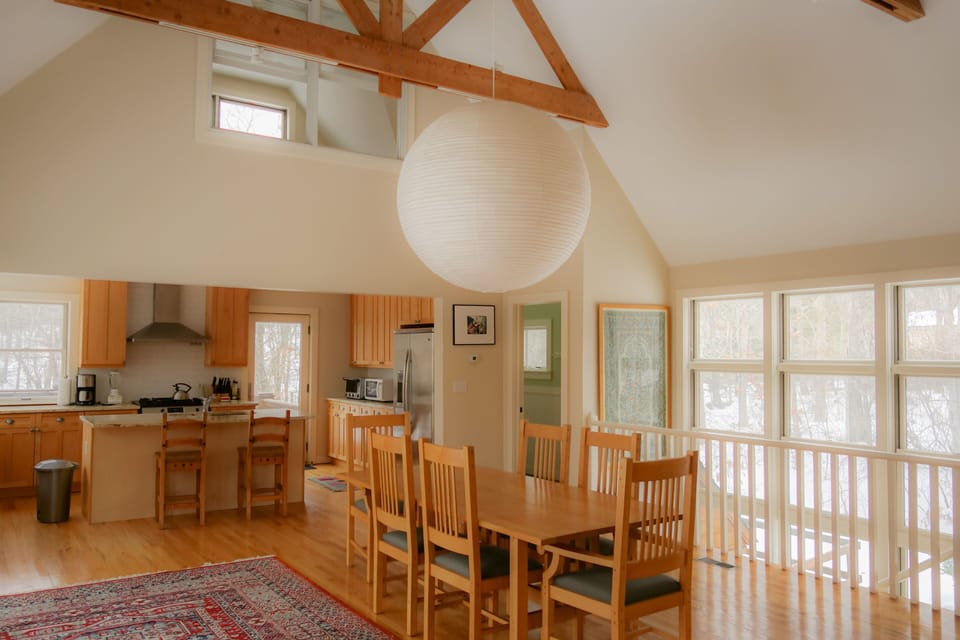 Kitchen door leads out to additional outdoor dining.