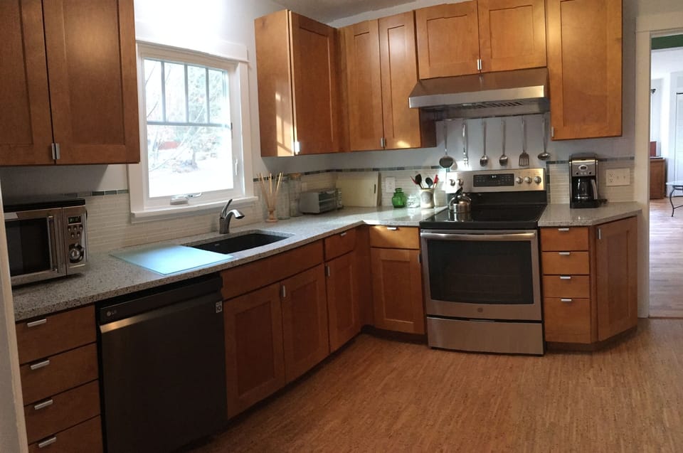 Fully remodeled kitchen with new cabinets, appliances and cork flooring