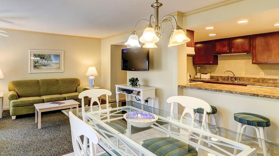 Share cocktails at the dining table beside the open kitchen.