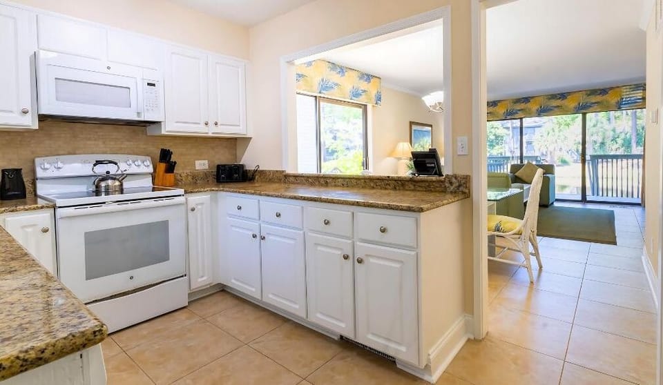 Cook easy meals in a bright kitchen with ample counters.