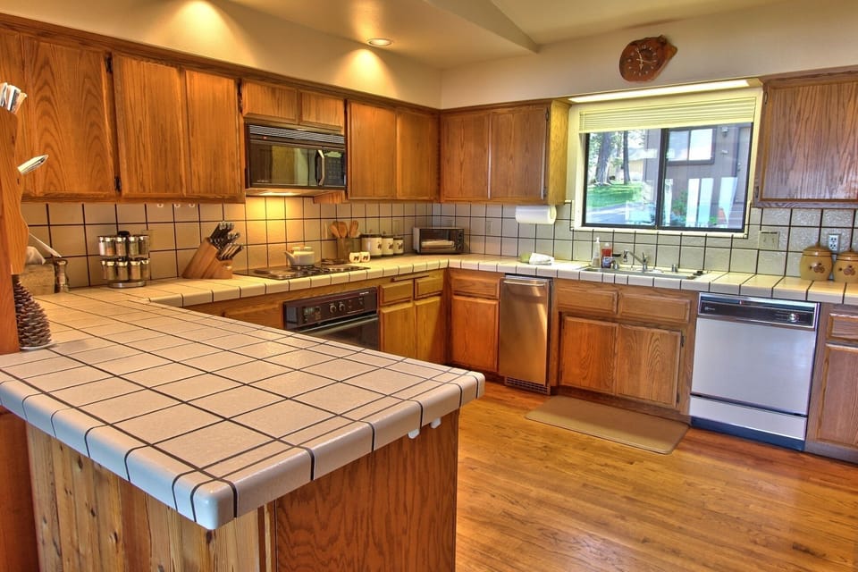 Kitchen is Fully Stocked With Appliances, Cook Ware and Dishes