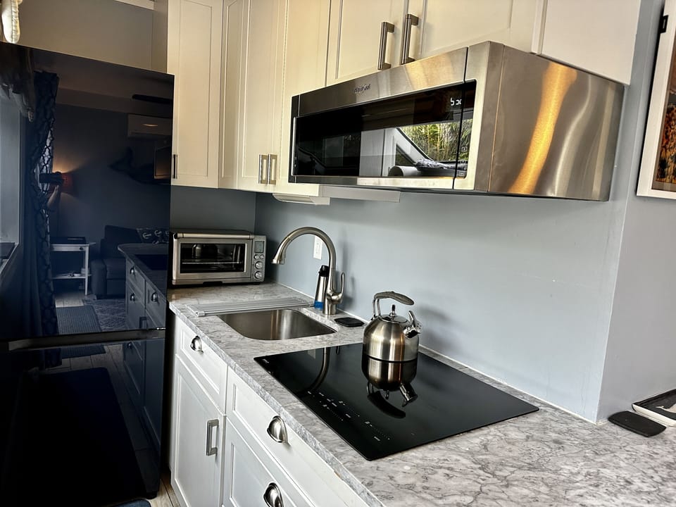 Induction Wolf Cooktop, Breville Smart Oven and Whirlpool Microwave