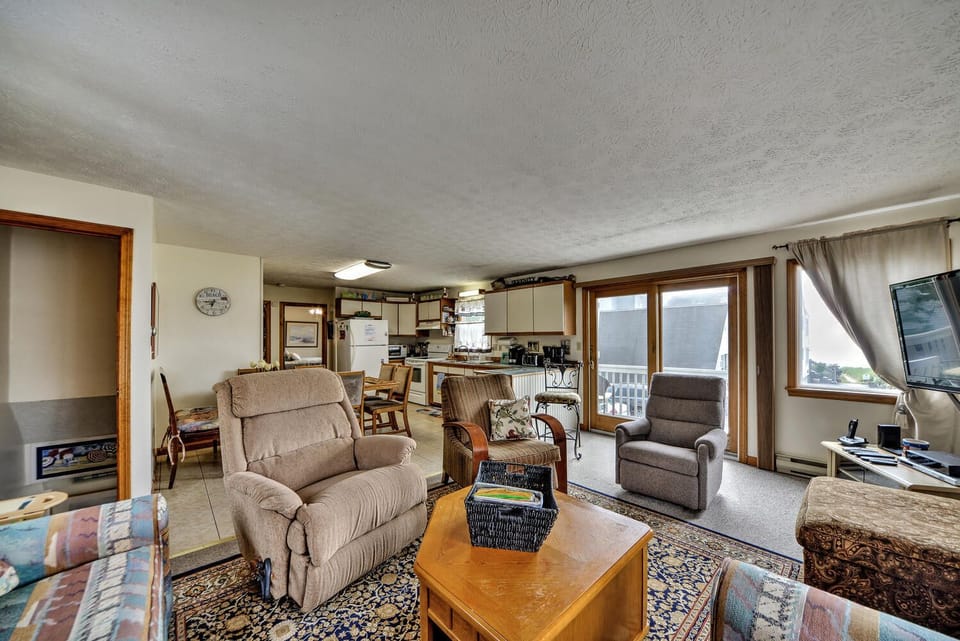  Patio doors open to large ocean front deck and view of beach - hear the surf!