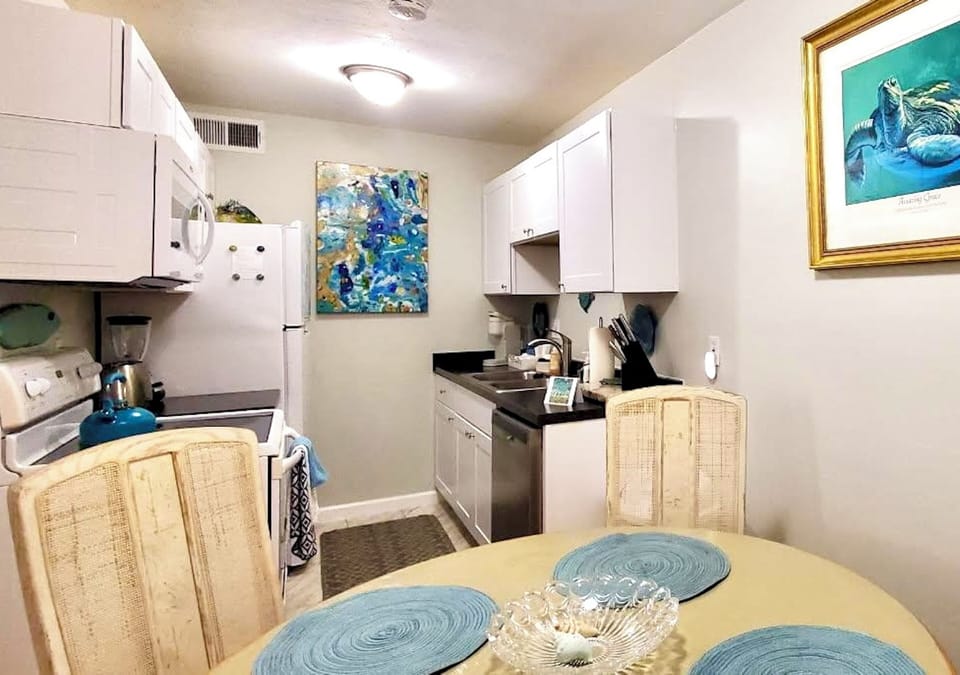 Fully stockedKitchen with dishwasher, looking in from dining area