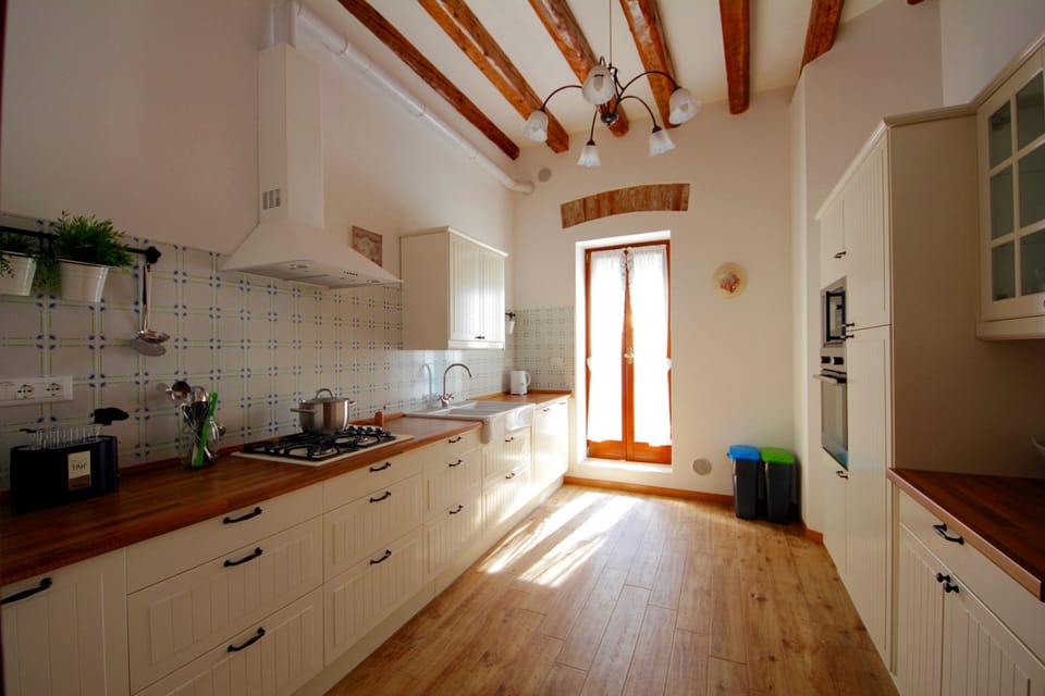 The Kitchen. The door gives access to the larger terrace.