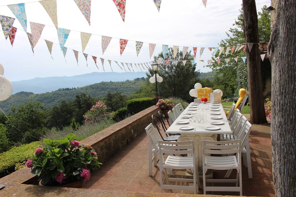 The terrace dining table set for a 70th birthday party July 2016.
