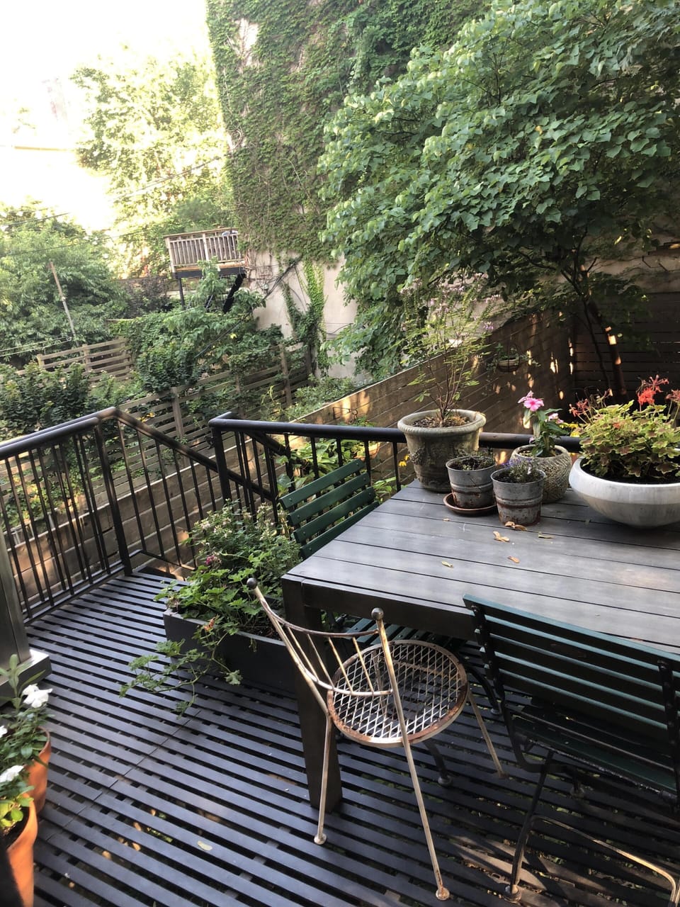Sunny rear deck off kitchen overlooks garden