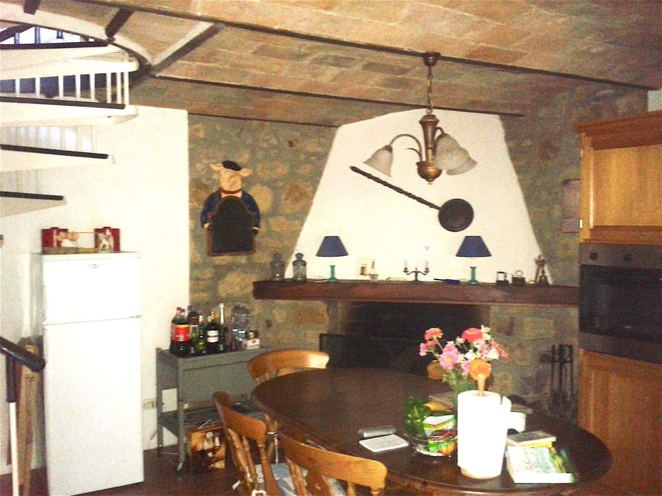 Another view of the kitchen/breakfast room with fireplace.