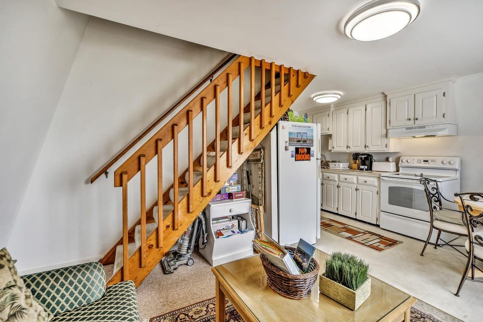 Kitchen is complete with all utensils, dishes,  and small appliances. 