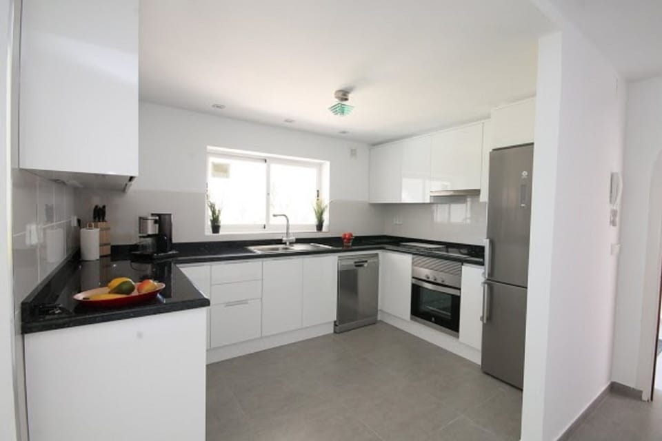 Modern brand new kitchen with granite work top and all equipment