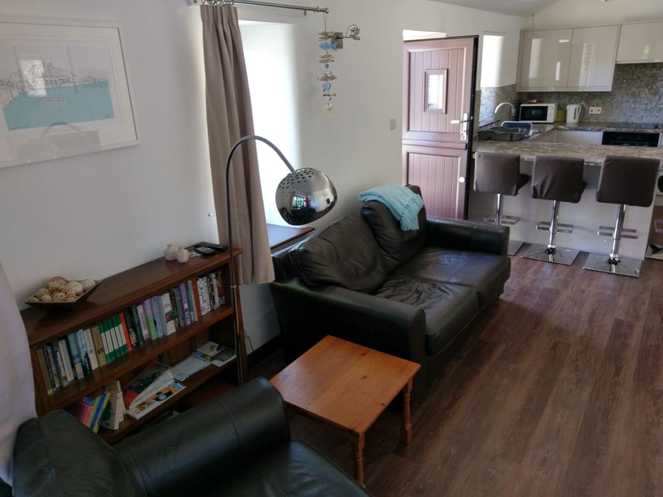 24 ft open plan lounge/kitchen with breakfast bar.