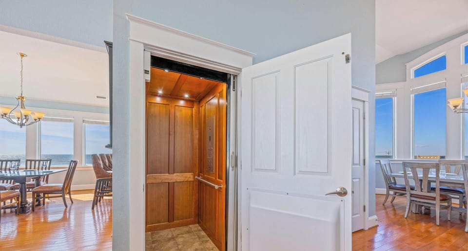 Surf or Sound Realty - 803 - Chicken by the Sea - Elevator - Label