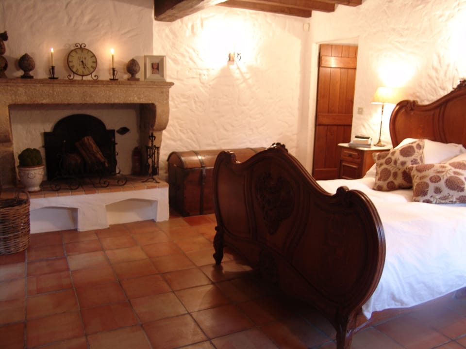 Master bedroom, with ensuite. Stone fireplace and access to private garden area