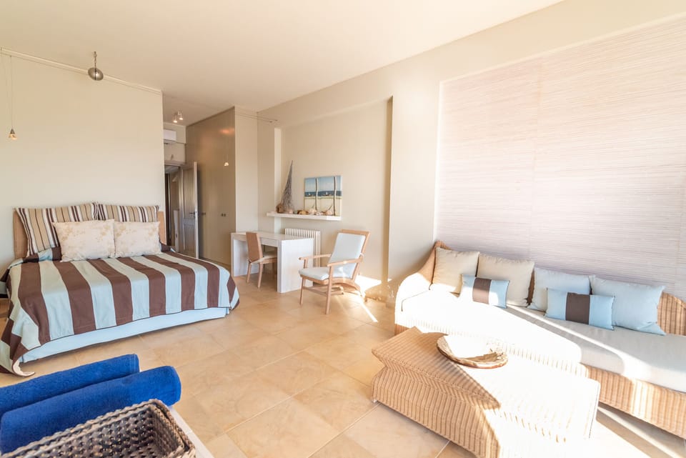 Double Bedroom with sea view on ground floor opens out onto garden and pool area