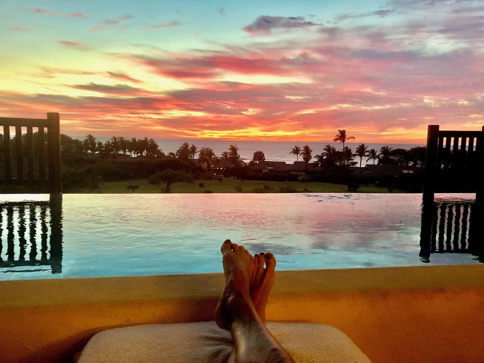 View from terrace chaise: infinity plunge pool looking out to the Pacific Ocean 