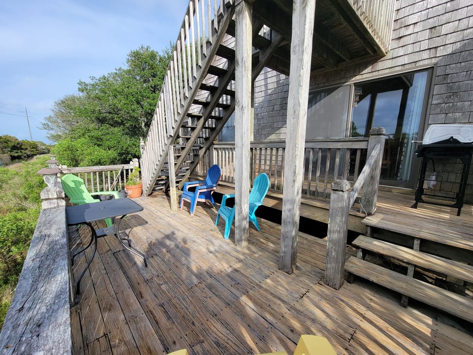 Our deck has a lovely view of the creek, a new gas grill, and plenty of chairs