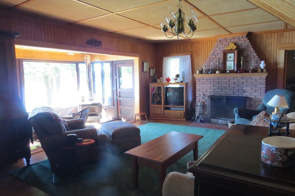 view from hall out of laundry  into living room area