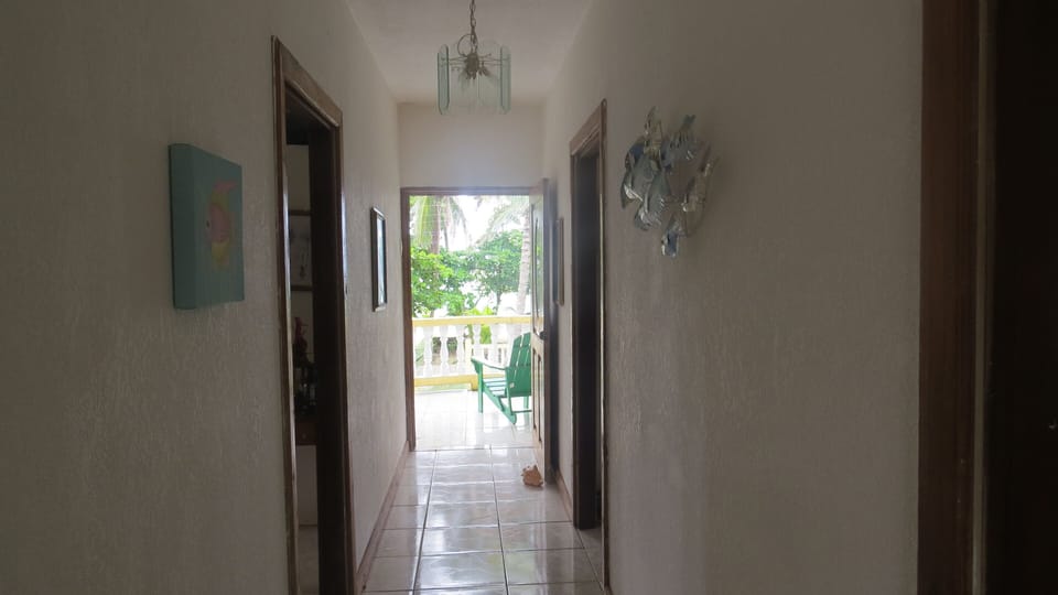 Upstairs hallway leading out to balcony.