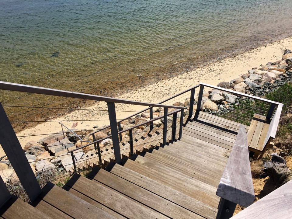 High tide. Stairs leading down to Powers Landing Beach.
