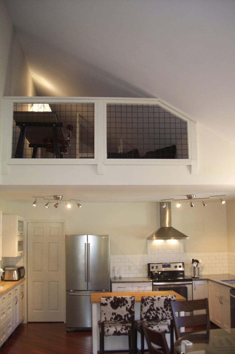 View of the loft above the kitchen.  Stairs to the loft are in the laundry room.