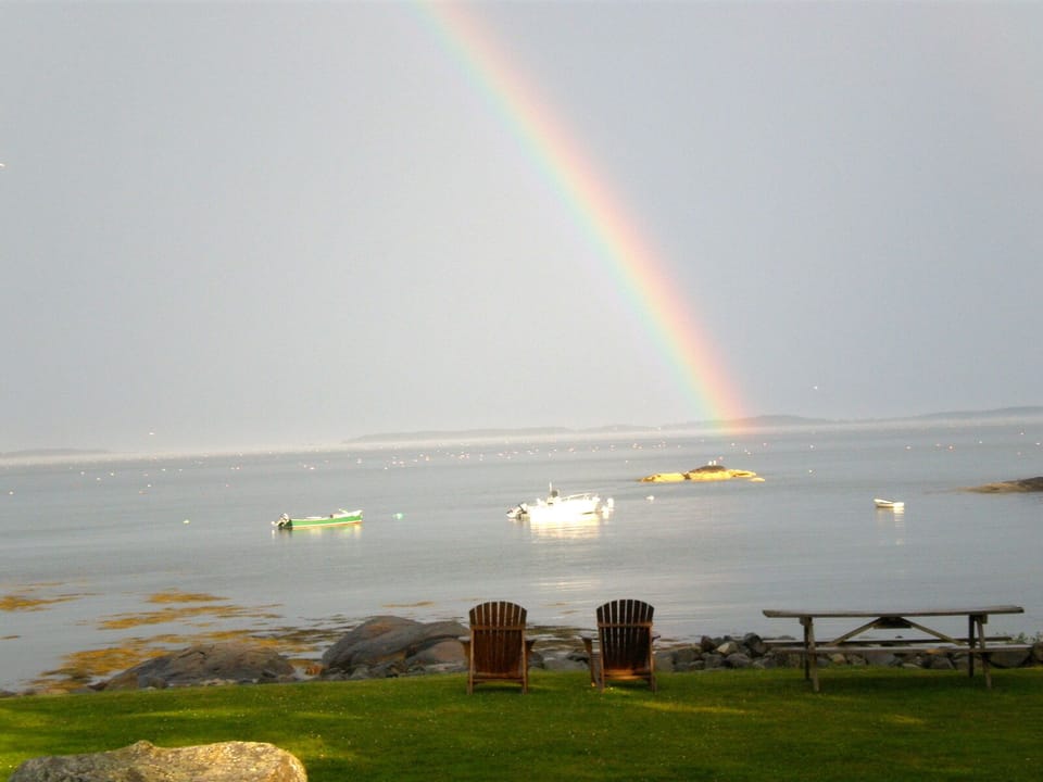 Capture a sunrise, or maybe a rainbow from our front lawn adjacent to the beach.