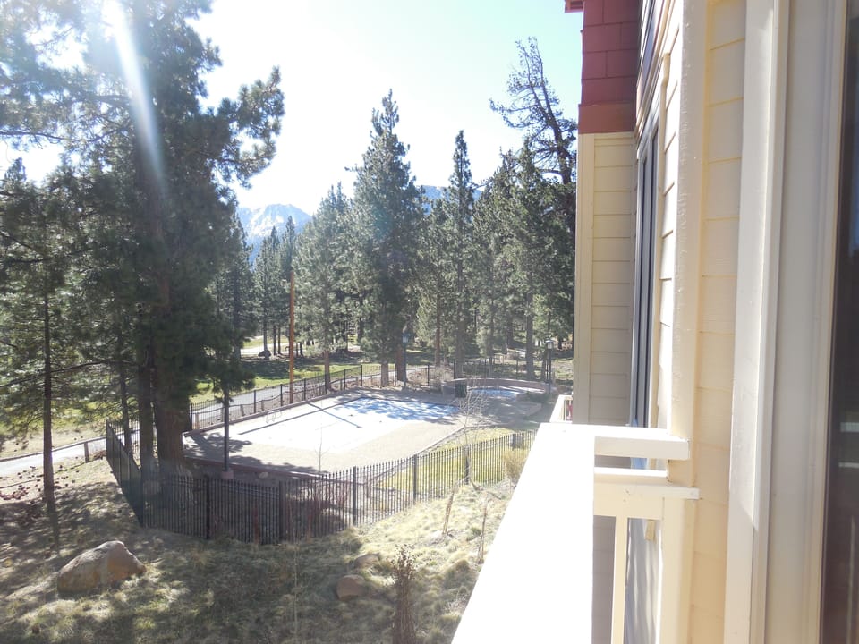 View of pool & jacuzzi from deck