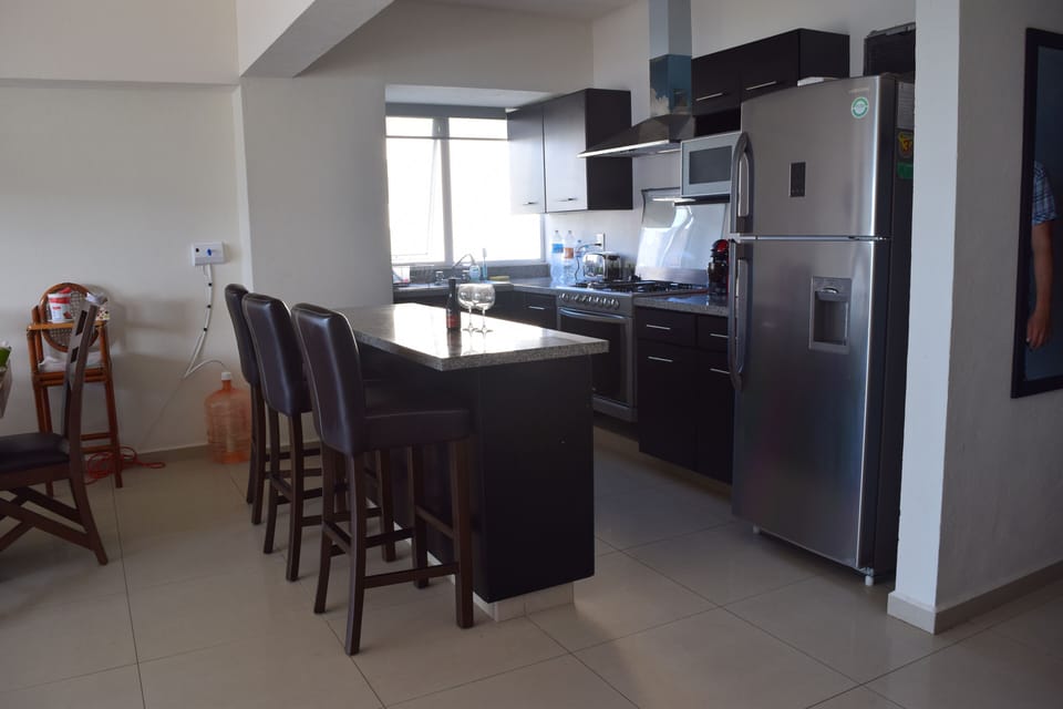View of the kitchen: There you have a breakfast bar all in marvelous granite