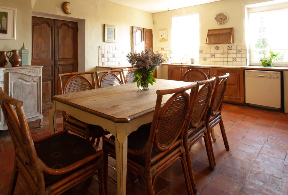 Kitchen with doors to playroom.