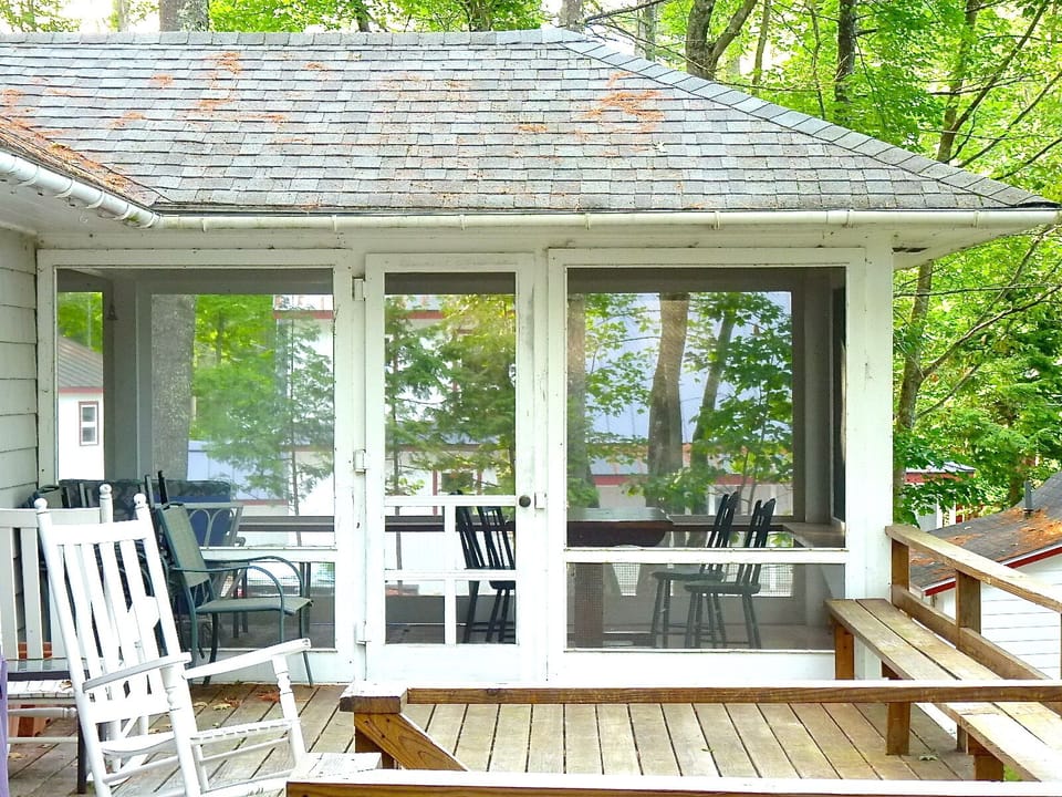 Enclosed porch with lake view.

