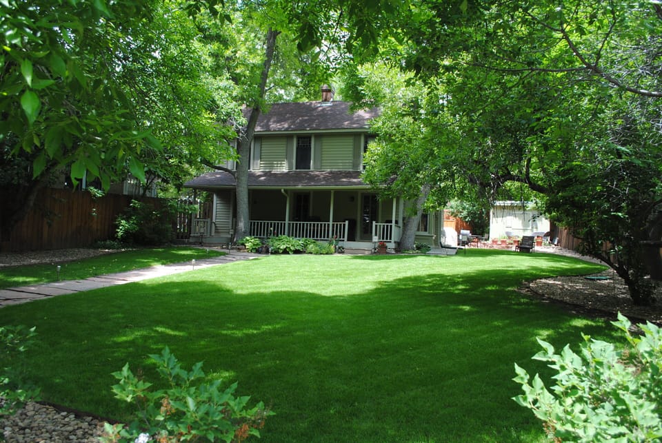 Great front lawn with large trees
