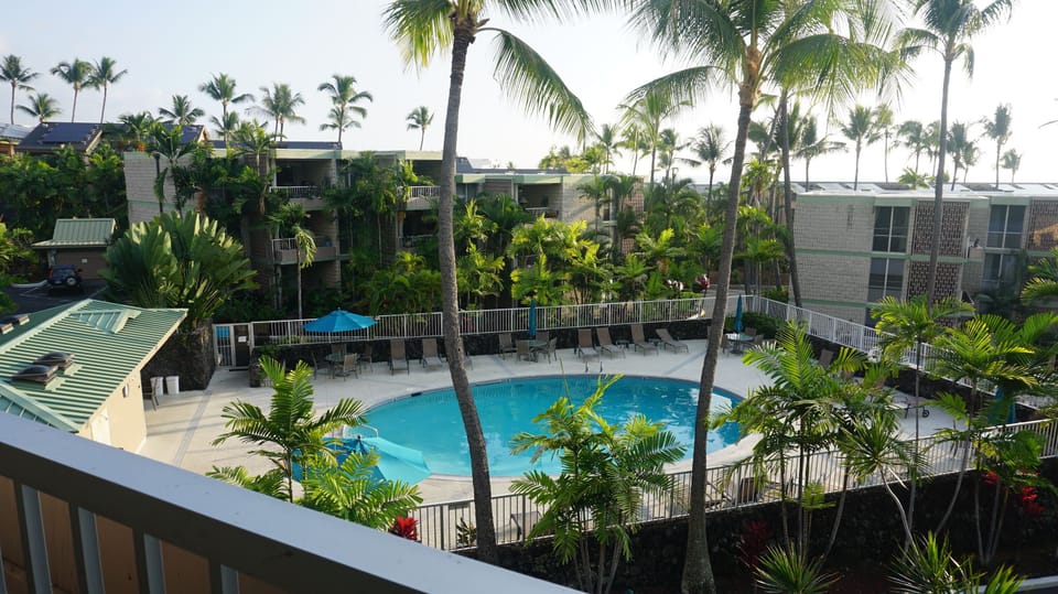 Daytime pool and ocean view from our lovely lanai