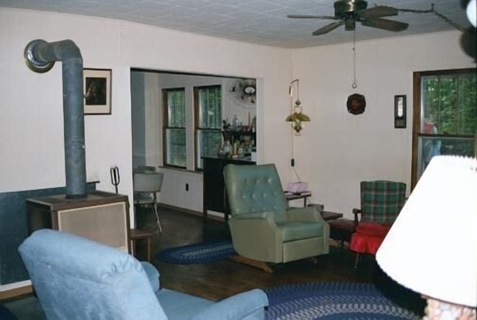 Living room with 2 recliners, couch and the wood burning stove.