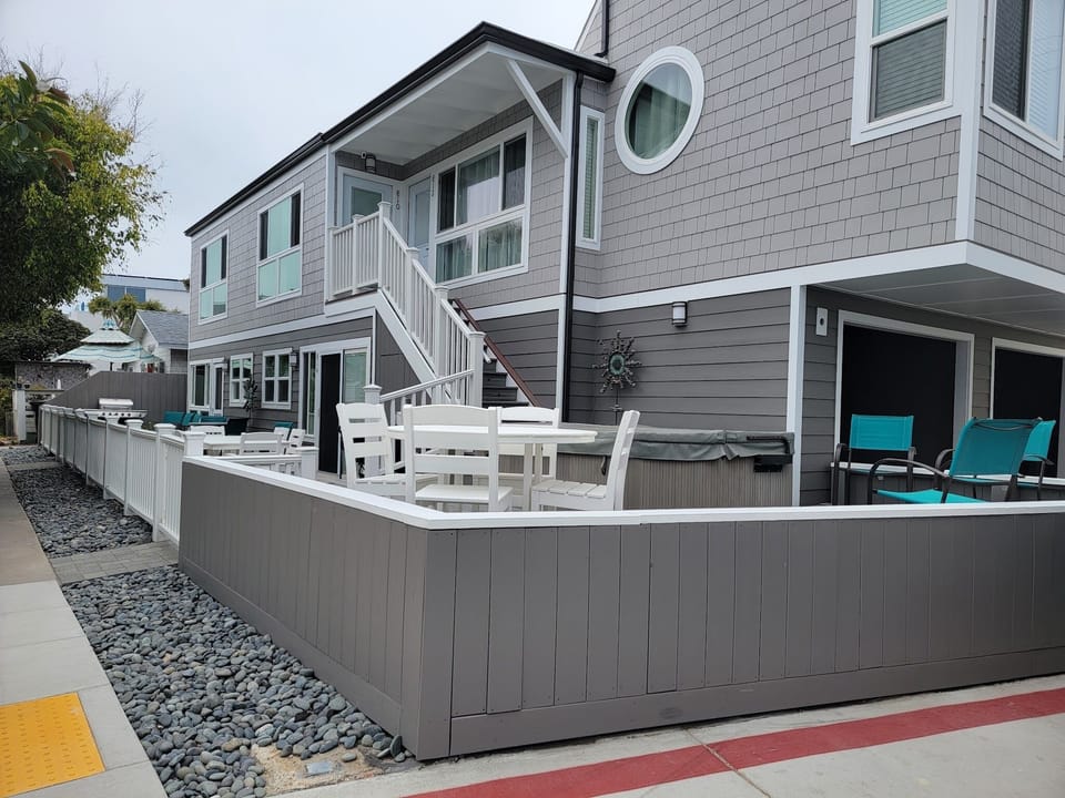 Courtyard with BBQ, table seating, spa and outdoor shower